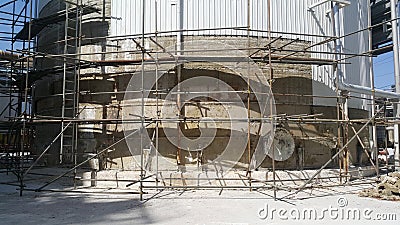 Renovate work for installation new metal sheet and insulation for storage tank , welding work on scaffolding Stock Photo