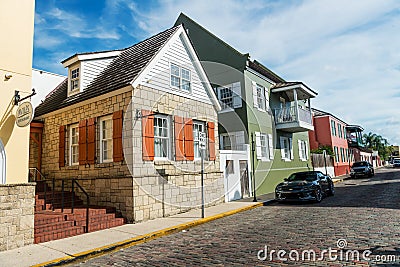 Renovated home with brown shutters on a narrow street in the old town of St. Augustine Editorial Stock Photo