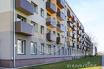Renovated and thermally insulated facade of a typical 1970s apartment building with balconies Stock Photo