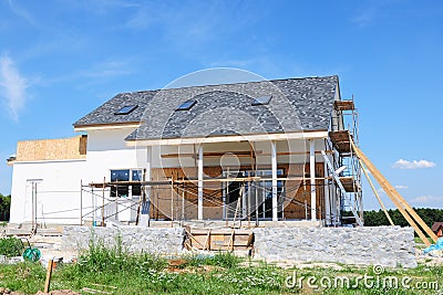 Renovation house with asphalt shingles roofing construction, painting wall, stucco, wall repair, insulation, attic skylight Stock Photo