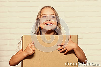 Rent house. Real estate. Make moving easier. Girl small child carry cardboard box. Packaging things. Move out concept Stock Photo