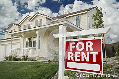 For Rent Real Estate Sign in Front of House Stock Photo