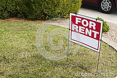 For rent sign with homes in background Stock Photo