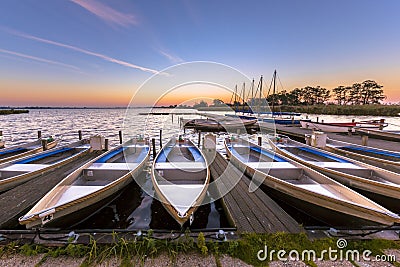 Rental boats in a marina at sunrise Stock Photo