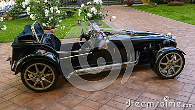 Rental roadster convertible with bows for a wedding, Camogli, Italy Editorial Stock Photo