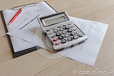 Renters insurance policy on a table. Couple Filling Insurance Appication Form Stock Photo