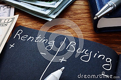 Renting vs buying comparison in the notebook Stock Photo