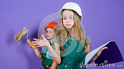 Repaint walls. Move in new apartment. Children sisters run renovation their room. Control renovation process. Sisters Stock Photo