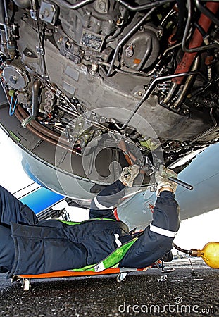 Repair of an aircraft engine on the takeoff field Editorial Stock Photo