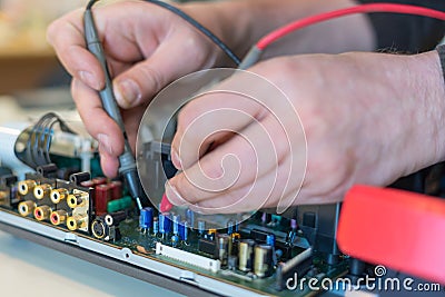 Repair of audio and video equipment. Fault diagnosis of the home theater Stock Photo