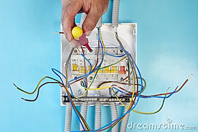 Repair of consumer unit fuse box in home electrical wiring network. Stock Photo