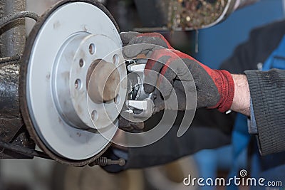 Repair disc brake - hand brake, which have been replaced in the auto repair shop Stock Photo