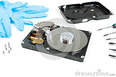 Repair of the dismantled hard drive. Screwdrivers for computer repair Stock Photo