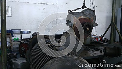 Workers repair of industrial machinery that is experiencing severe damage. Repair of compressor engines. Stock Photo