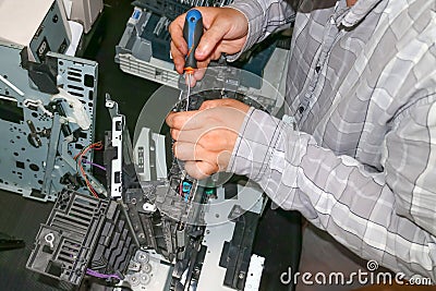 Repair of the laser copier-printer in the service center. Replacing worn gears. Stock Photo