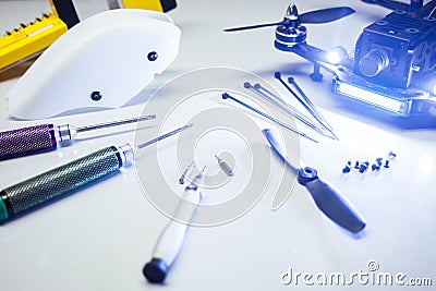 Repair maintenance drone, screws, screwdrivers, battery clamps Stock Photo