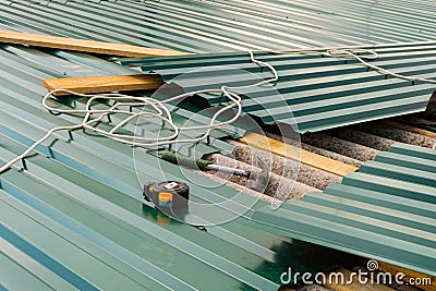 Repair of the old roof made of asbestos-cement sheets Stock Photo