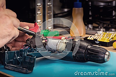 Repair of power tools in the service center Stock Photo