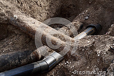 Repair and replacement main pipeline of heating systems, district heating pipes network, water supply or Sewerage in city, Stock Photo