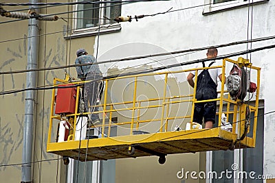 Repair and restoration of a facade of a building in the city Editorial Stock Photo