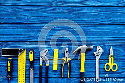 Repair tool kit background. Blue wooden table top view pattern copy space Stock Photo