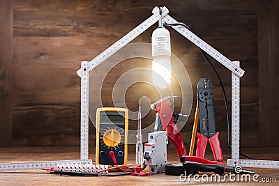 Repair Tools Under The Illuminated House Stock Photo