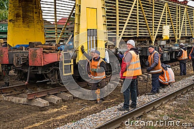 Repair workers modernize the Irpin-Bucha railway line on Kiev region. Editorial Stock Photo