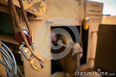 Repairer working inside the confined space at mean time connecting back up safety rope with three two one pulleys system Stock Photo