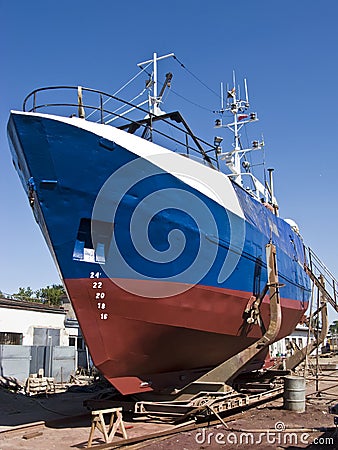 Repairing fishing boat Stock Photo