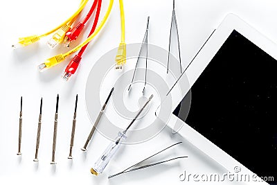 Repairing gadgets. Parts, wires and tools on white background top view Stock Photo