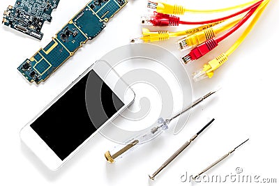 Repairing gadgets. Parts, wires and tools on white background top view Stock Photo