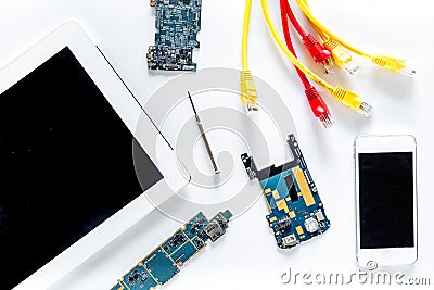 Repairing gadgets. Parts, wires and tools on white background top view Stock Photo