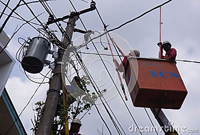 Repairing power lines Editorial Stock Photo