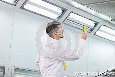 Repairman checking shades cards for car painting, Worker painter checking color matching before painting, Garage painting car Stock Photo
