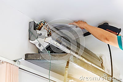 Repairman clean mold dirty inside compartments air conditioner in system air conditioning system, maintenance concept Stock Photo