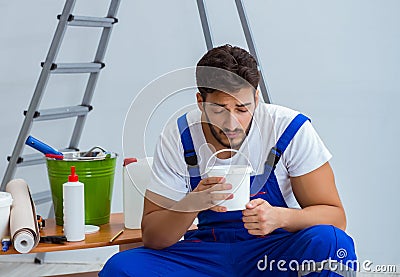 Repairman doing renovation repair in the house with paper wallpa Stock Photo