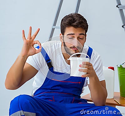 Repairman doing renovation repair in the house with paper wallpa Stock Photo