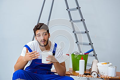 Repairman doing renovation repair in the house with paper wallpa Stock Photo