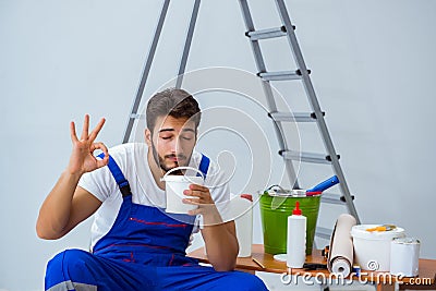Repairman doing renovation repair in the house with paper wallpa Stock Photo