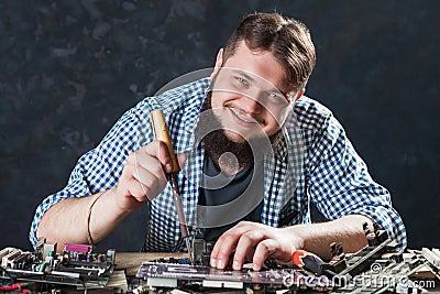 Repairman fixing problem with soldering tool Stock Photo
