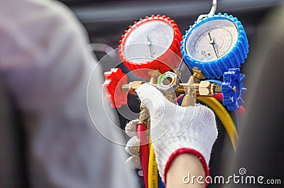 Repairman holding monitor tool to check and fixed car air conditioner system, Technician check car air conditioning system Stock Photo