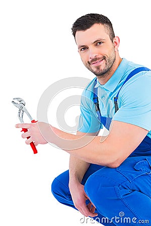 Repairman holding pliers Stock Photo