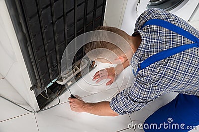 Repairman Making Refrigerator Appliance Stock Photo