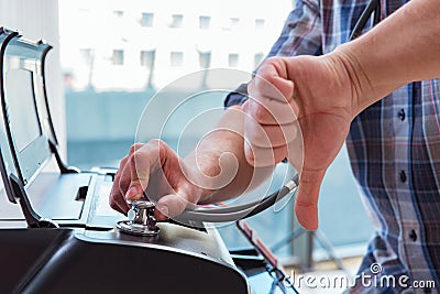 The repairman repairing broken color printer Stock Photo