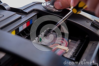 The repairman repairing broken color printer Stock Photo