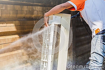 Repairman washing dirty inside compartments air conditioner, Technical team clean mold in system air conditioning system Stock Photo