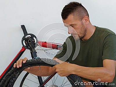 Repairs bicycle wheel, hole in bicycle tire Stock Photo