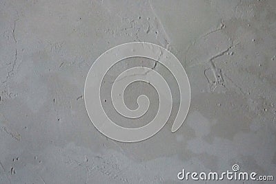 Repairs. Wall. Uneven and damp gray plaster on the wall. Building material texture. photo Stock Photo