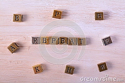 Repeat word metal block Stock Photo