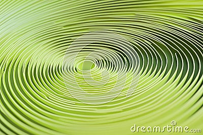 repeated circular pattern in light green, gently rotating to create a continuous flowing animation. Stock Photo